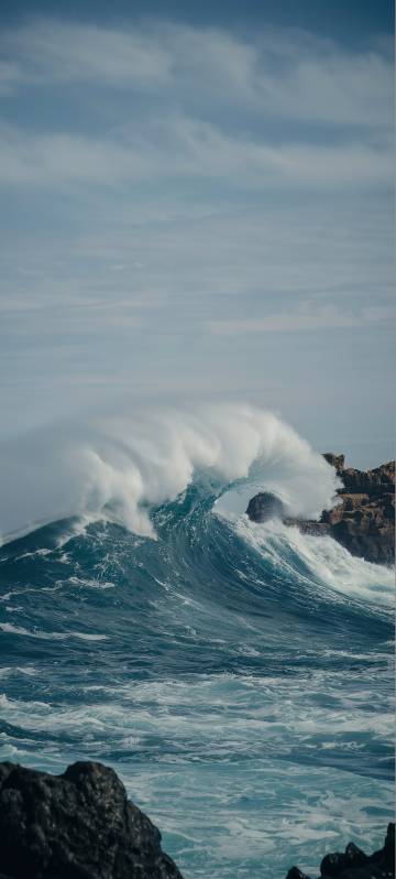 Seaside mobile wallpaper, rocks, waves, white clouds