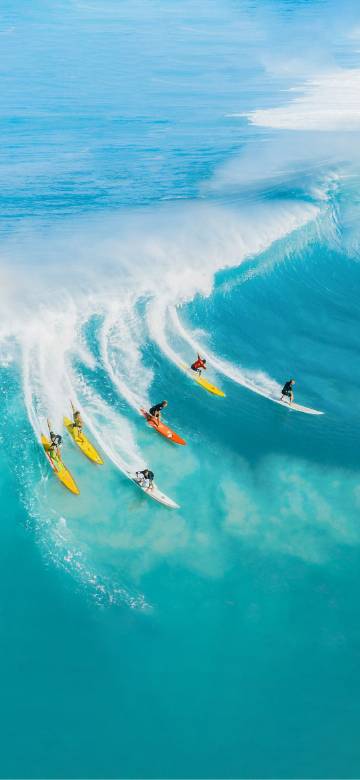 Surfers on the blue sea phone wallpaper