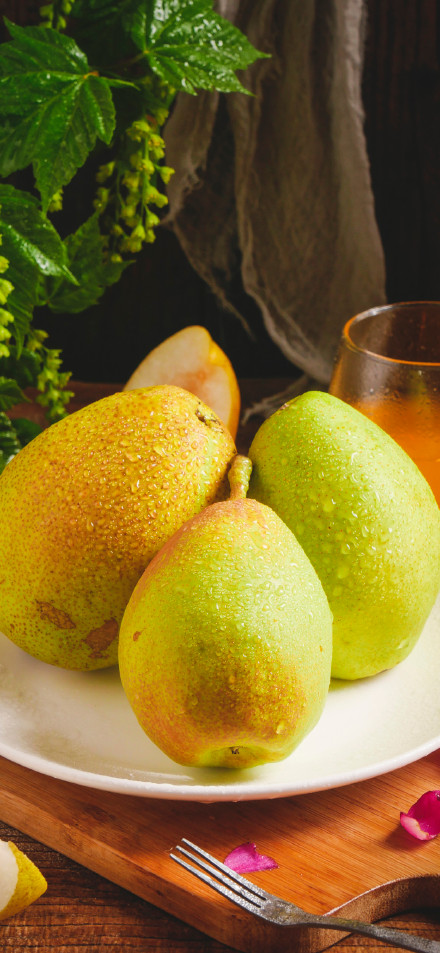 Close-Up of Fresh Pear on Desk 4K Wallpaper