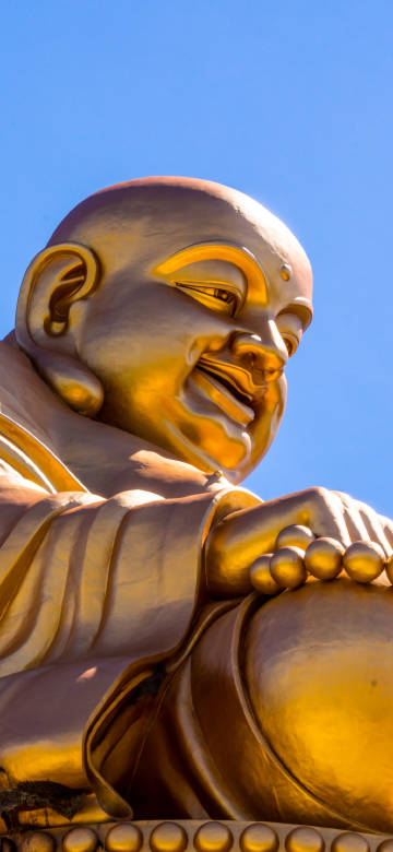 Huge golden Maitreya Buddha statue 4K wallpaper