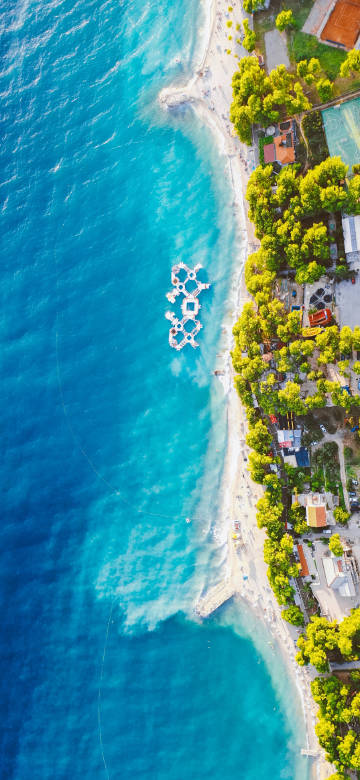 Aerial Beach View 4K Wallpaper: White Sand and Blue Ocean