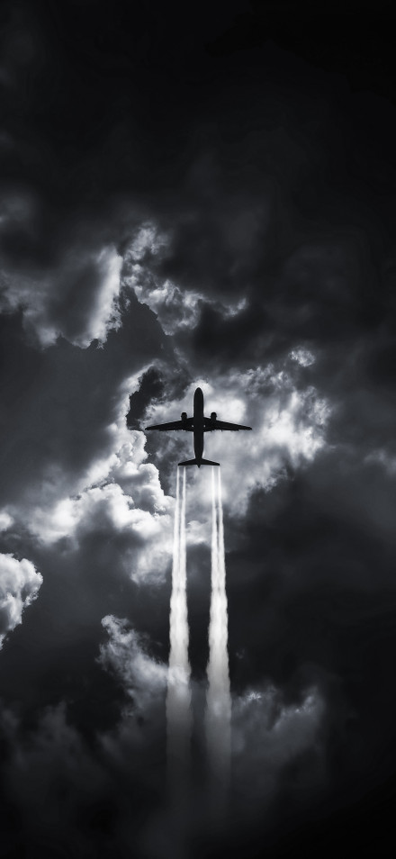 Clouds and Airplane in Moody Sky 4K Wallpaper