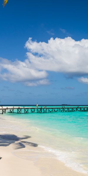 Breathtaking view of Constance Halaveli Resort's lagoon and pier in Maldives