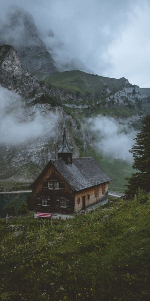 Beautiful Swiss Church Surrounded by Majestic Mountains