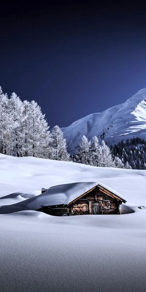 Beautiful Snowy Mountain Scene with Cozy House