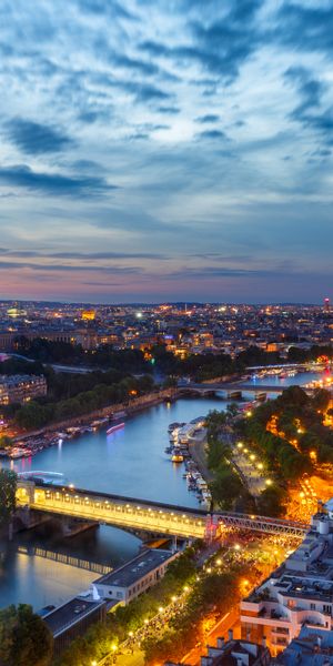 Enchanting Paris Nightscape: Eiffel Tower and River Seine - Phone Wallpaper