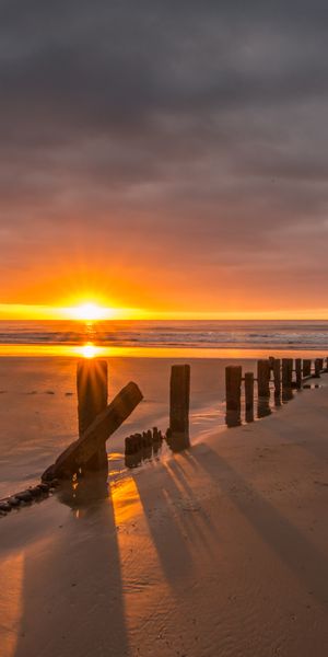 Beautiful Sunset Over Beach Pillars - Perfect Mobile Wallpaper