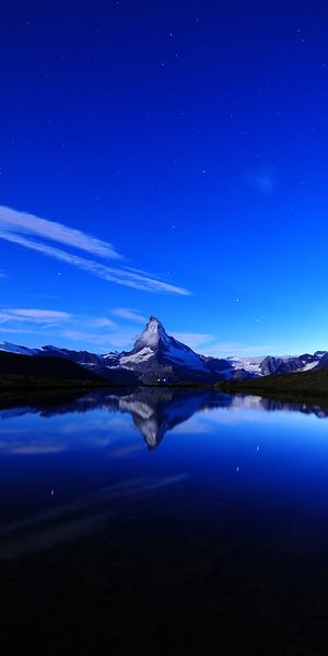 Nighttime Reflection of a Mountain in a Tranquil Lake