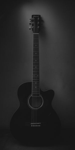 Elegant Black Acoustic Guitar Wallpaper for Music Enthusiasts