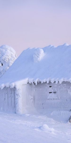 Charming Snow-Covered House in a Winter Wonderland