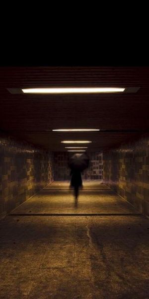 Creepy Ghost Strolling Through a Dark Tunnel