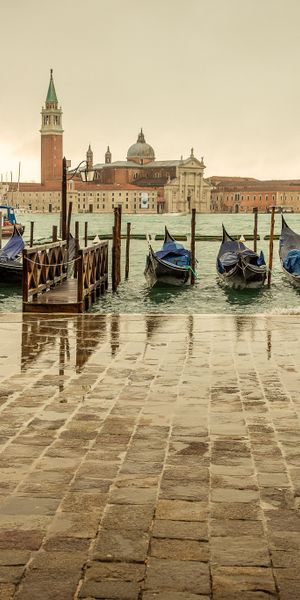 Charming Venice waterfront scene with gondolas - perfect phone wallpaper
