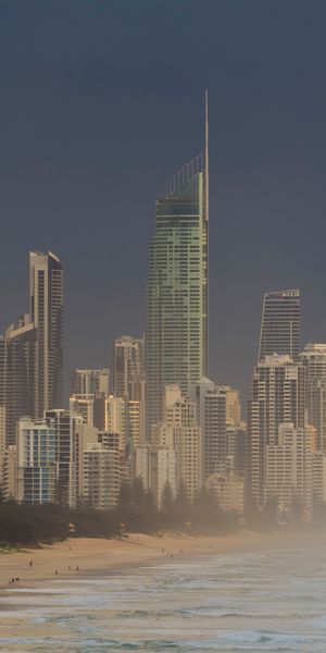 Breathtaking Gold Coast Morning: Waves, City, and Fog - iPhone Wallpaper