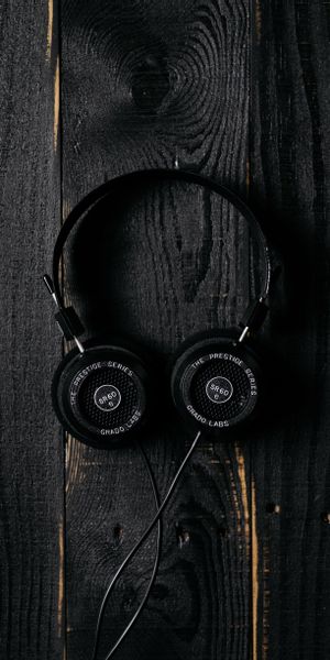 Stylish Black Headphones on Dark Wooden Surface