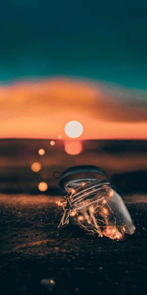 Glowing Jar at Sunset on the Shore