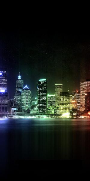 Vibrant Night Cityscape with Colorful Lights and Reflections