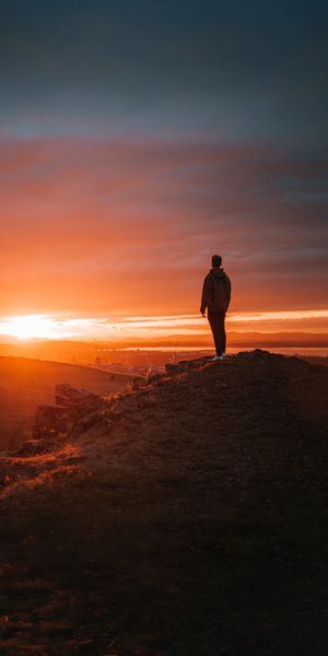 Lonely Figure Against a Breathtaking Sunset
