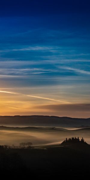 Breathtaking Sunset Over Misty Hills