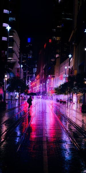 Vibrant Neon Night Street Scene with Silhouettes
