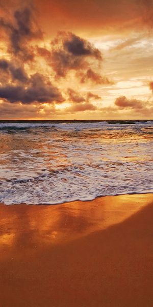 Breathtaking beach sunset wallpaper: perfect phone background with ocean vibes