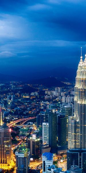 Breathtaking Kuala Lumpur Cityscape Featuring Petronas Towers at Night