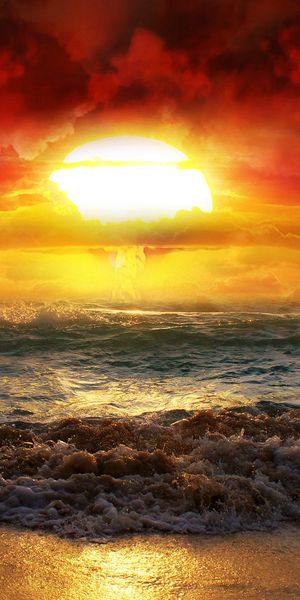 Breathtaking phone wallpaper featuring a sunset over the ocean waves