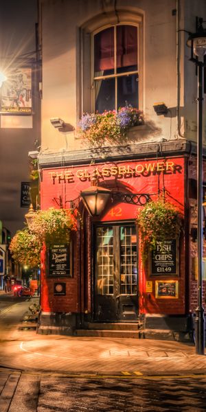 Charming London Pub at Night: A Perfect Urban Background for Your Space