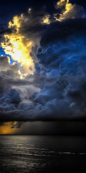Breathtaking Bali Sunset: Stormy Clouds Over Seashore - Phone Wallpaper