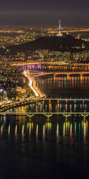 Breathtaking Seoul Night Cityscape Wallpaper Featuring River and Bridge