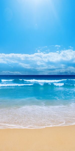 Breathtaking beach wallpaper featuring azure skies and tranquil waves