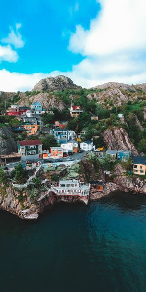 Charming Coastal Village Nestled Among Rocky Mountains
