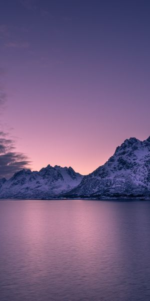 Breathtaking Sunset Over Snowy Mountains in a Calm Archipelago