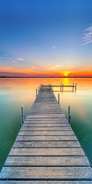 Breathtaking Sunset Over a Lake Pier