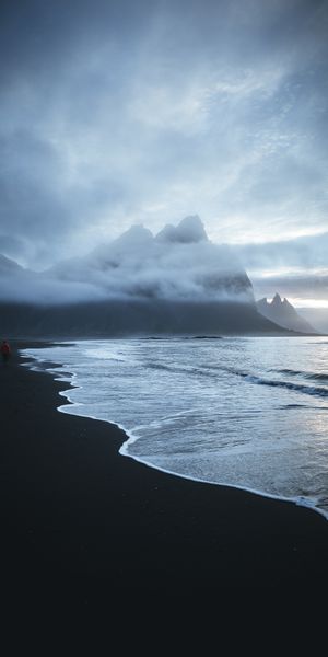 Lonely Beach with Waves and Mountains