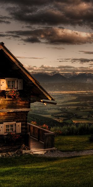 Charming Cabin Wallpaper: Sunset Over Hills and Mountains