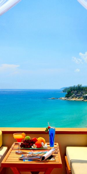 Breathtaking Turquoise Sea and Sky View Phone Wallpaper