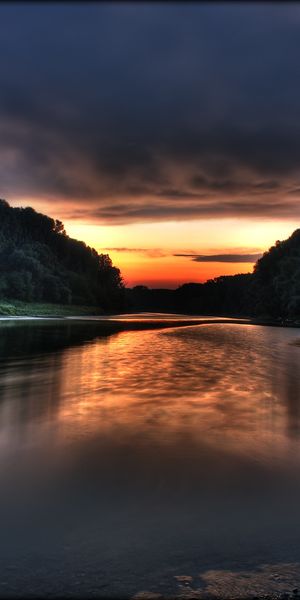 Breathtaking HD mobile wallpaper of a river at sunset with trees