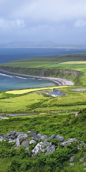 Breathtaking Coastal Landscape with Lush Fields and Serene Sea