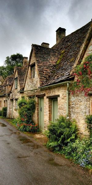 Serene Village Pathway Surrounded by Beautiful Historical Buildings