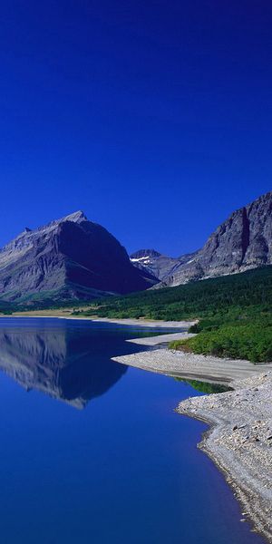 Serene Earth Landscape Phone Wallpaper Featuring Majestic Mountains and Calm Waters