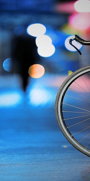 Charming Night City Bicycle Wallpaper for Your Phone