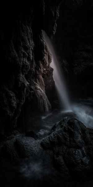 Dark Waterfall in a Cave - A Breathtaking Nature Scene