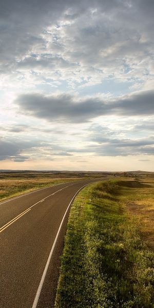 Breathtaking mobile wallpaper featuring a winding road under a radiant sun