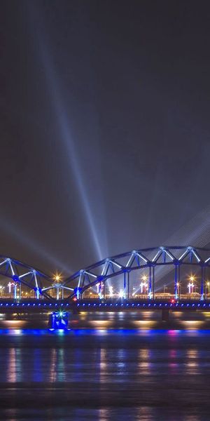 Phone wallpaper: Cable Bridge, Riga, Cable Stayed Bridge, Beams, Rays, Bridge, Cities, Rivers free d
