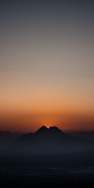 Breathtaking Sunset with Foggy Mountains at Dusk