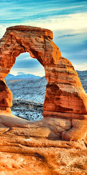 Breathtaking Arch Amidst Rocky Mountains