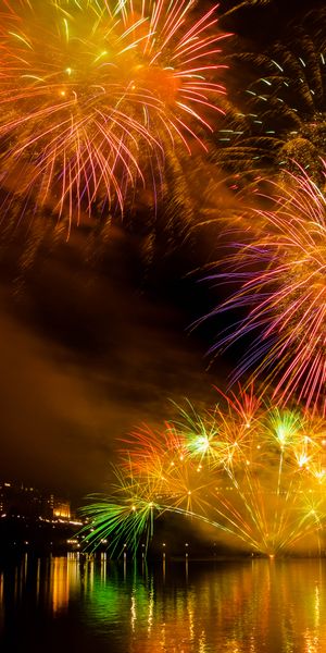 Phone wallpaper: Salute, Motley, Holidays, Sparks, Multicolored, Night free download