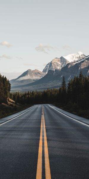 Breathtaking Road Through Mountain Landscape Wallpaper