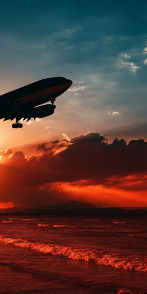 Passenger Plane Silhouette Against a Breathtaking Sunset