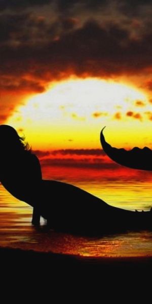 Enchanting Mermaid at Sunset - 4K Phone Wallpaper for Fantasy Lovers